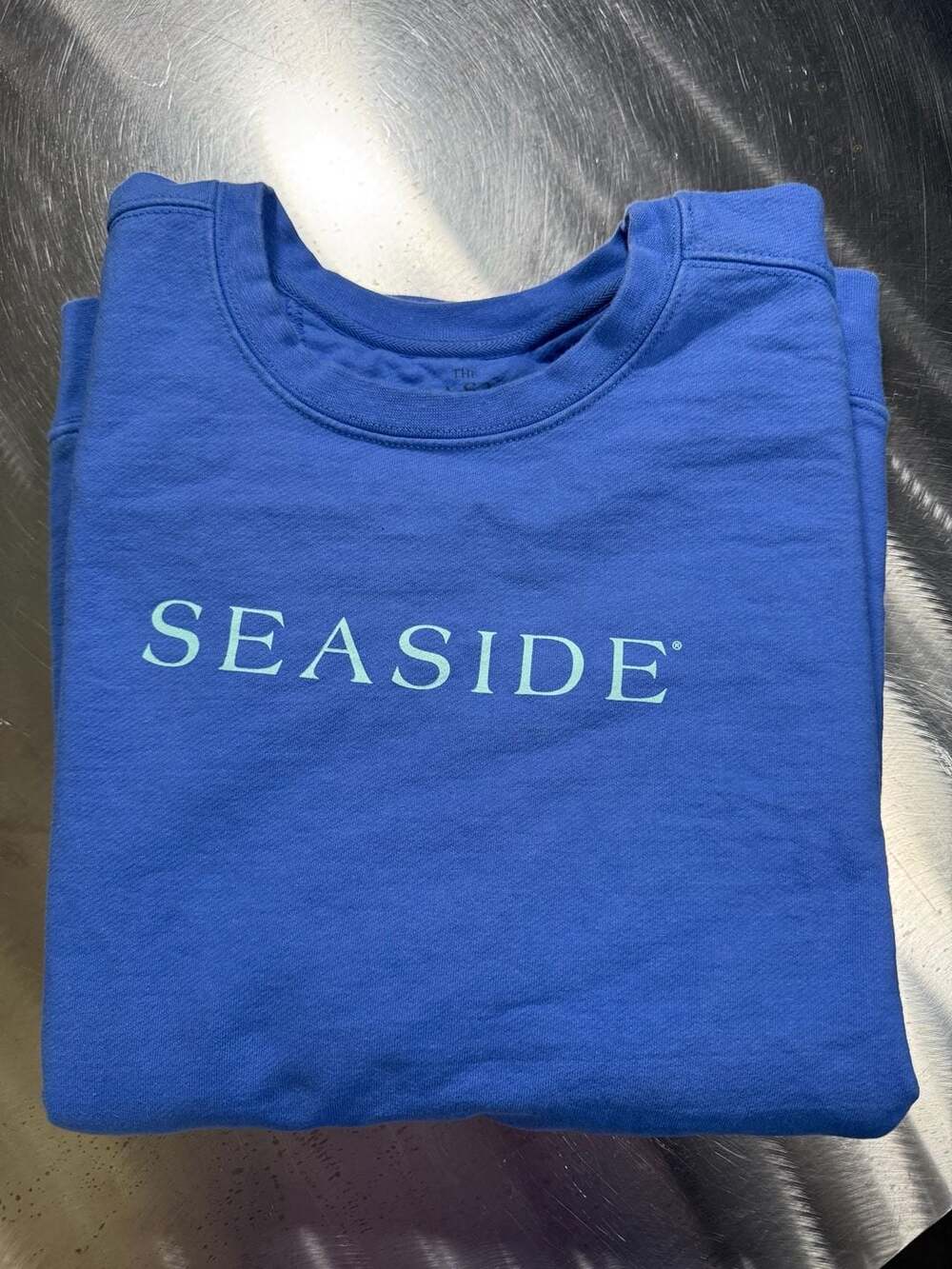 The Seaside Style Blue Crewneck Sweatshirt The New Town The Old Ways Graphic
